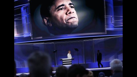 President Barack Obama is seen on a screen as Smith leaves the stage Monday.