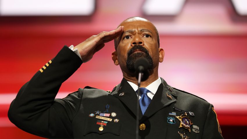Milwaukee County Sheriff David Clarke salutes the crowd prior to delivering a speech on the first day of the Republican National Convention on July 18, 2016 at the Quicken Loans Arena in Cleveland, Ohio. An estimated 50,000 people are expected in Cleveland, including hundreds of protesters and members of the media. The four-day Republican National Convention kicks off on July 18.