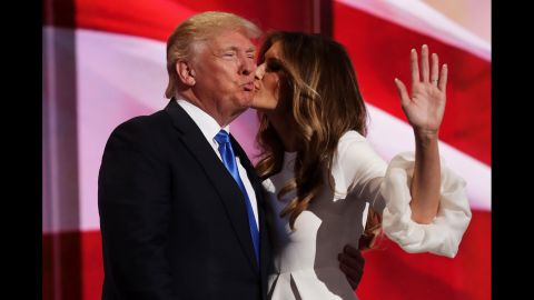 Melania Trump kisses her husband, Donald, after she spoke Monday on the first day of the convention. "If you want someone to fight for you and your country, I can assure you, he's the guy," she said of her husband. "He will never, ever give up. And most importantly, he will never, ever let you down."