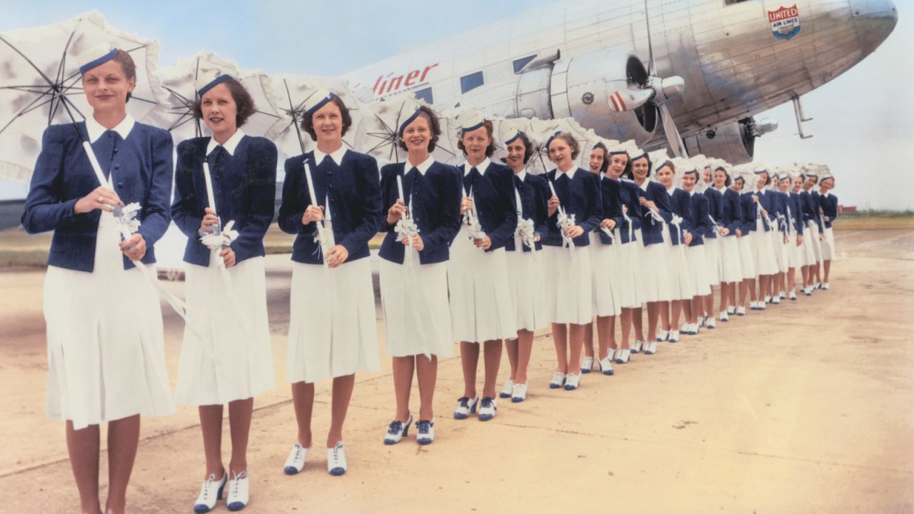 United started coordinating their flight attendant uniforms with the company's colors in this 1939 look by in-house designer Zay Smith. These outfits were used for the airline's Douglas DC-3 service. 