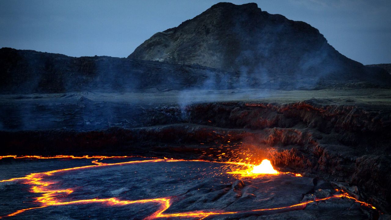 Deep in the Danakil Desert, Erta Ale (Smoking Mountain) is a continuously active volcano and one of only six on the planet with a permanent lava lake. A 10-kilometer trail leads across a volcanic wasteland to the crater rim, where hikers can eyeball nature's own sound and light show before camping overnight.