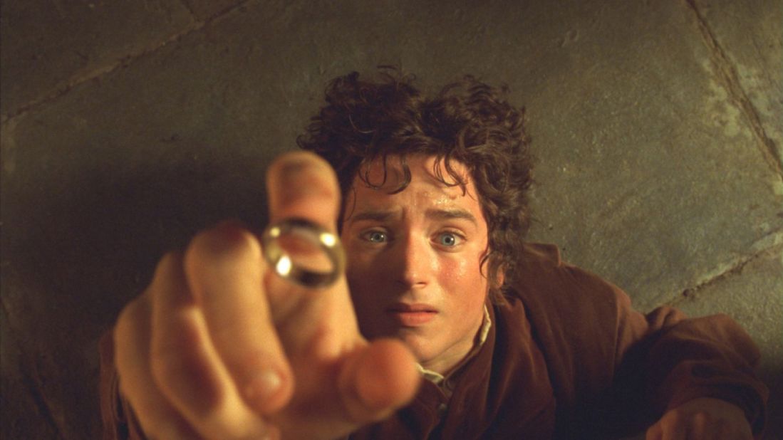 Actor Elijah Wood as Frodo Baggins in "The Lord of the Rings: The Fellowship of the Ring" with the One Ring, which makes the wearer invisible.