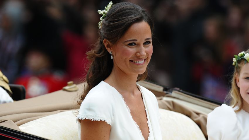 Maid of honour Philippa Middleton smiles as the travels in a Semi-State Landau in London after the wedding service for Britain's Prince William and Kate, Duchess of Cambridge, on April 29, 2011.   AFP PHOTO / PAUL ELLIS (Photo credit should read PAUL ELLIS/AFP/Getty Images)