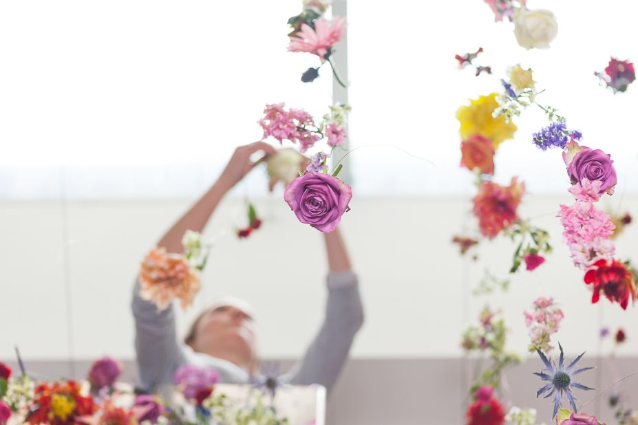 Waste is not an option for the artist, who requests that flowers from old installations be turned into smaller works encased in glass, hung in bunches, or returned to her to be incorporated in new works.