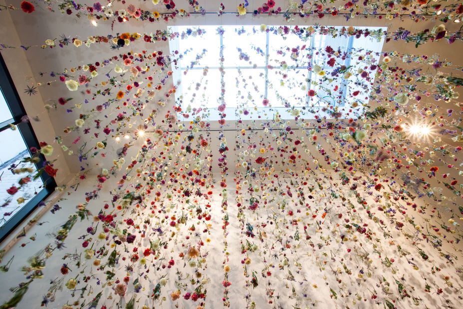 Artist Rebecca Louise Law is known for her vast installations comprised of cut flowers. Galleries and private patrons have commissioned the in-demand Brit to fill their spaces with up to 150,000 flowers, which gradually decompose before drying out.