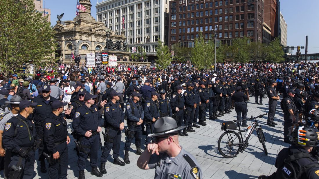 Police separate protesters in Cleveland's Public Square on Tuesday, July 19. Various groups are protesting in the city, which is hosting the Republican National Convention this week.