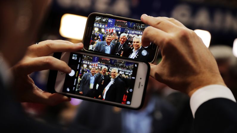 Delegates take a photo with Mississippi Gov. Phil Bryant, center, on Tuesday.