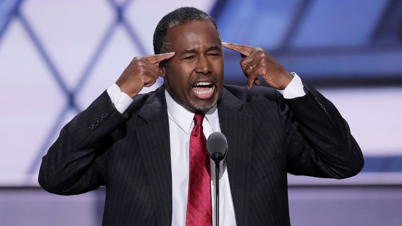Ben Carson, a retired neurosurgeon and former presidential candidate, speaks on stage Tuesday. He said Trump skeptics who would vote for Hillary Clinton are "not using their God-given brain to think about what they're saying. ... She'll be appointing people who will have an effect on us for generations. And America may never recover." 