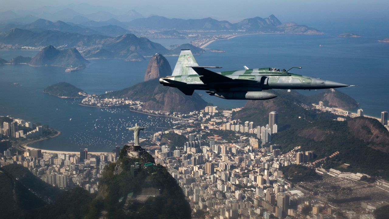 An F-5 fighter flies over Rio during a Brazilian Air Force security demonstration before the Games.