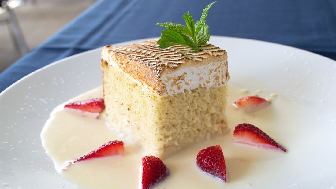 <strong>Tres leches cake in Houston:</strong> Originally from Nicaragua, the moist tres leches cake has found a new hub in Houston. The city's Ibiza Food and Wine Bar serves one of the more refined versions of tres leches in town -- topped with browned Italian meringue and accented with fresh-cut strawberries.