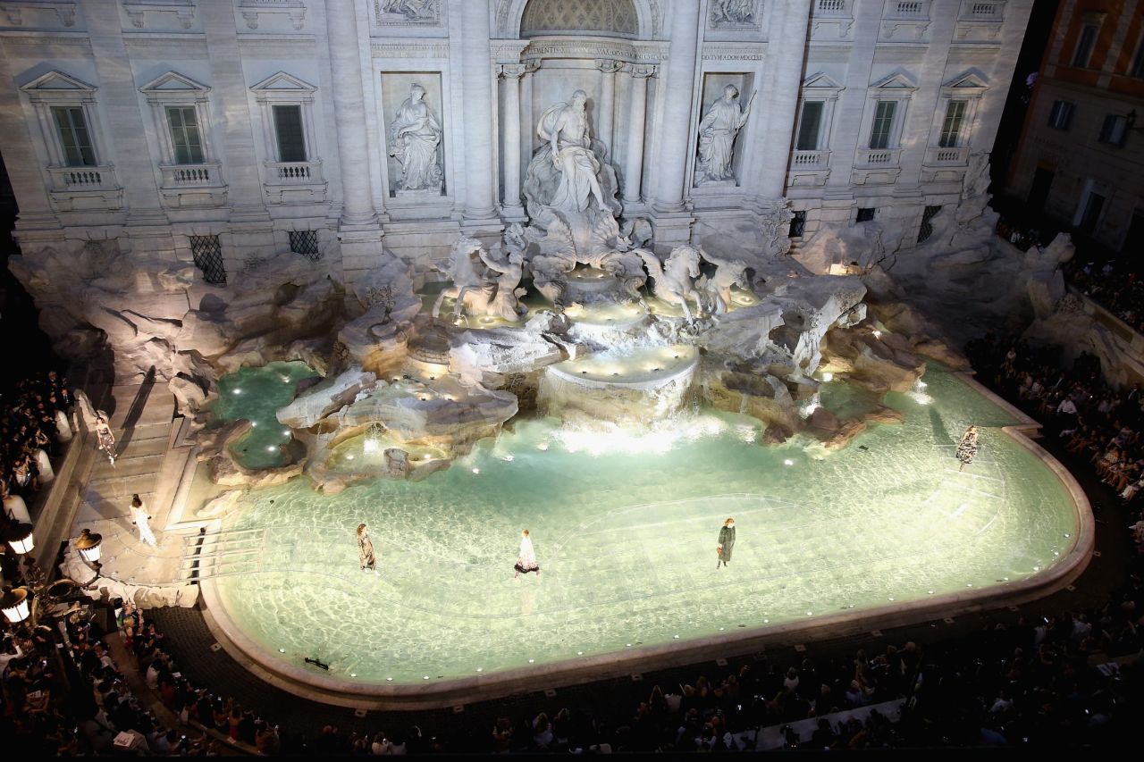 Karl Lagerfeld and Fendi wowed the fashion world with a show-stopping display of couture presented on a glass walkway that curved across the Trevi Fountain. 