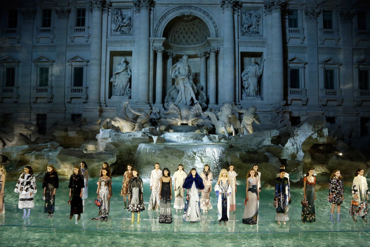 Models stand in their final looks at the show staged to mark Fendi's 90th anniversary. 