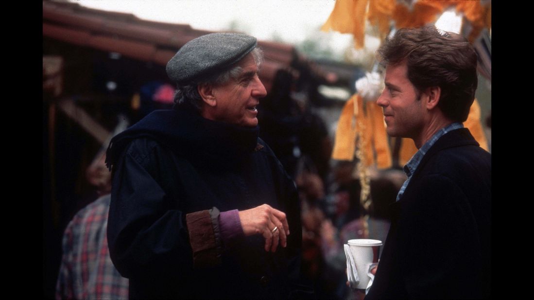 Marshall talks with actor Greg Kinnear on the set of "Dear God" in 1996. 