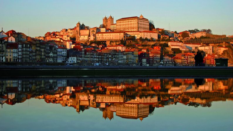 <strong>Douro:</strong> Porto's colorful old neighborhood climb up on steep hills on both banks of the Douro. It's especially charming at sunset when rays of sunlight give the waters a gilded glow. 
