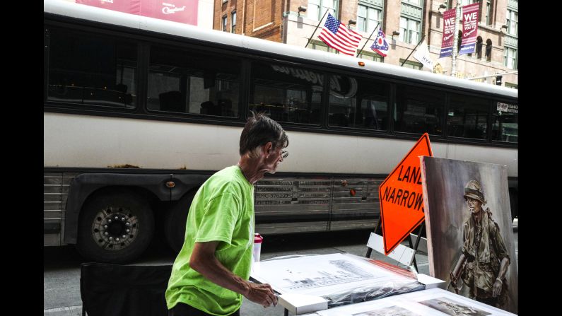 Vendors line the street near the convention, selling everything from paintings to Trump apparel to Cavaliers memorabilia.