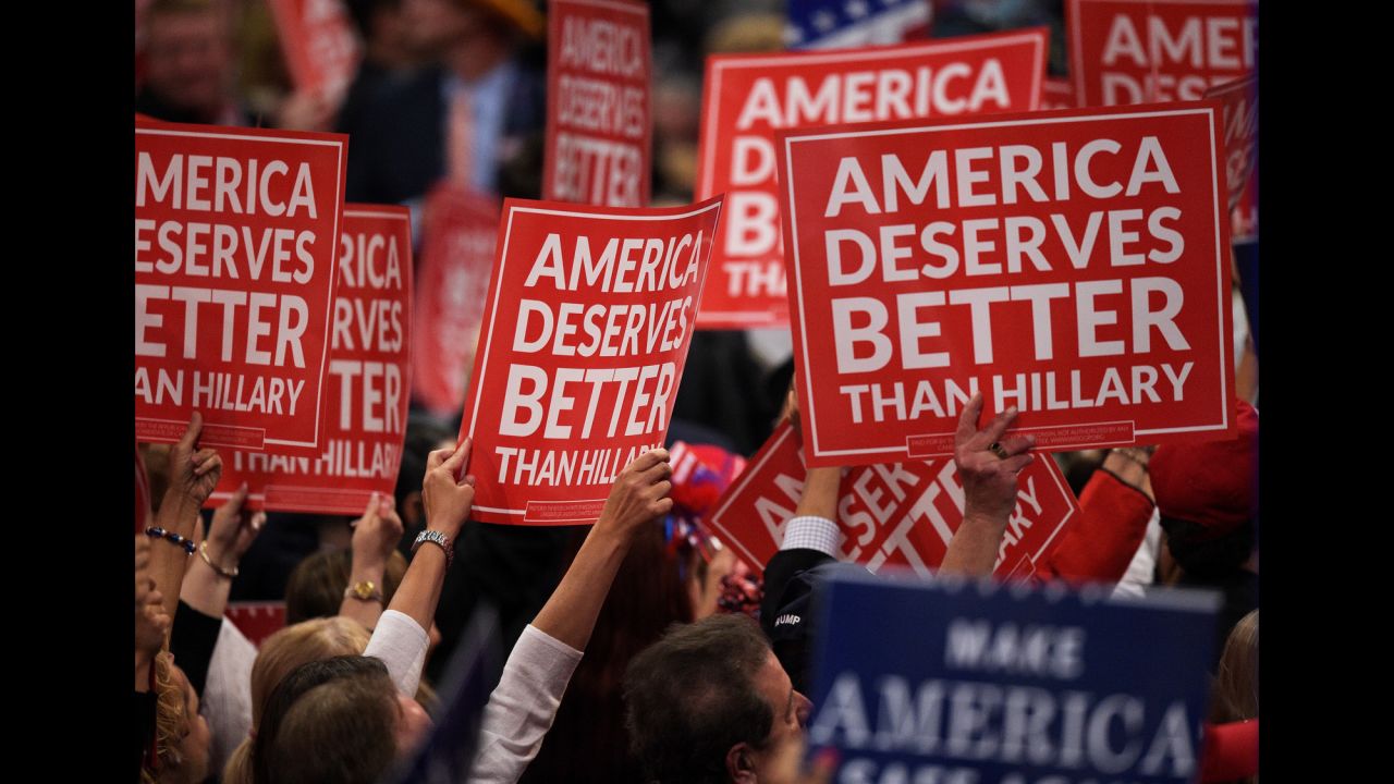 Delegates hold up signs Wednesday.