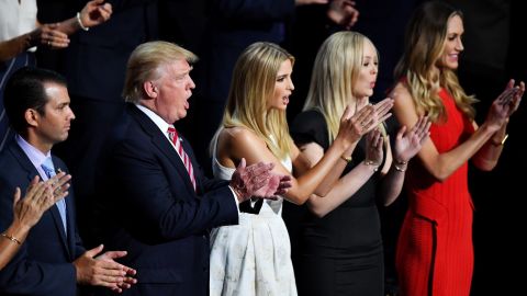 Trump listens to his son's speech along with other members of his family on Wednesday.