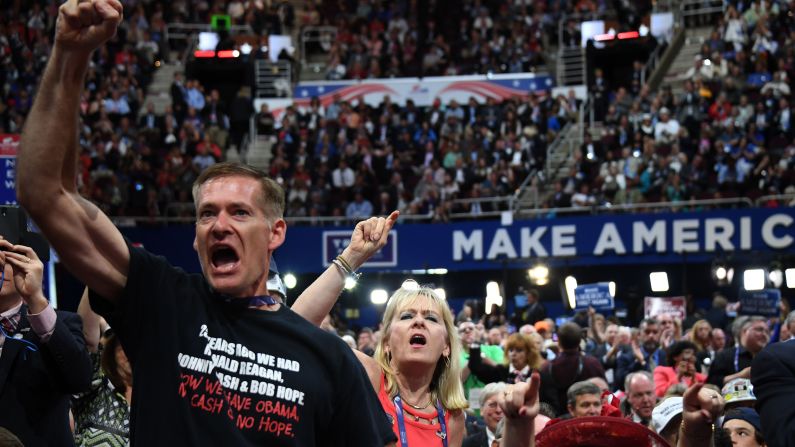 Delegates shout on the floor of the arena on Wednesday.