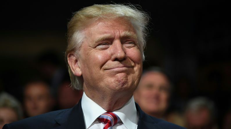 Trump smiles on the floor of the convention on Wednesday.