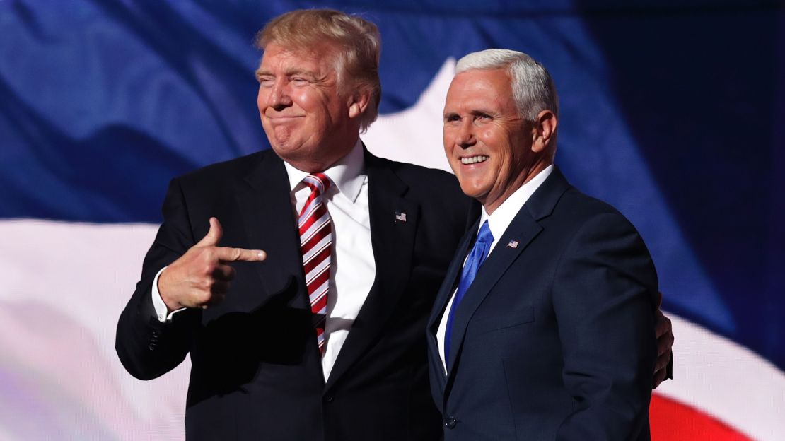 Donald Trump stands with Republican vice presidential candidate Mike Pence and acknowledge the crowd on the third day of the Republican National Convention on July 20, 2016 in Cleveland, Ohio.