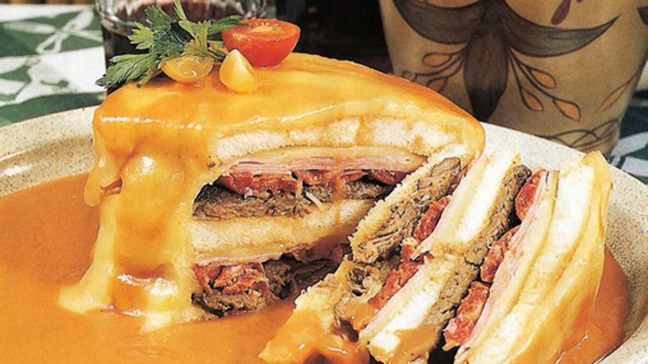 Porto's favorite snack, francesinha -- or "little French girl"-- is bread filled with ham, sausages and steak, wrapped in cheese. The combo is then drenched in a spicy sauce.