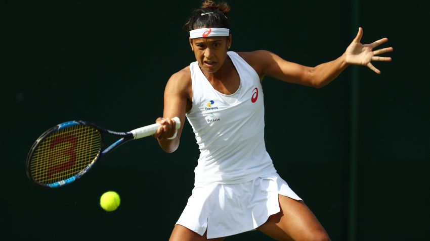 LONDON, ENGLAND - JUNE 27:  Teliana Pereira of Brazil plays a forehand shot during the Ladies Singles first round against Varvara Lepchenko of The United States on day one of the Wimbledon Lawn Tennis Championships at the All England Lawn Tennis and Croquet Club on June 27th, 2016 in London, England.  (Photo by Julian Finney/Getty Images)