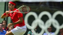Switzerland's Roger Federer returns the ball to France's Julien Benneteau during their men's single tennis match second round during the London 2012 Olympic Games in London on July 30, 2012.       AFP PHOTO/Luis Acosta        (Photo credit should read LUIS ACOSTA/AFP/GettyImages)