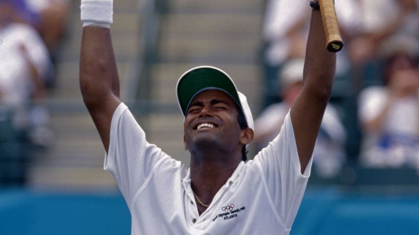 Indian tennis player Leander Paes celebrates after winning the bronze in tennis at the 1996 Olympic Games. (Photo by Jean-Yves Ruszniewski/TempSport/Corbis/VCG via Getty Images)