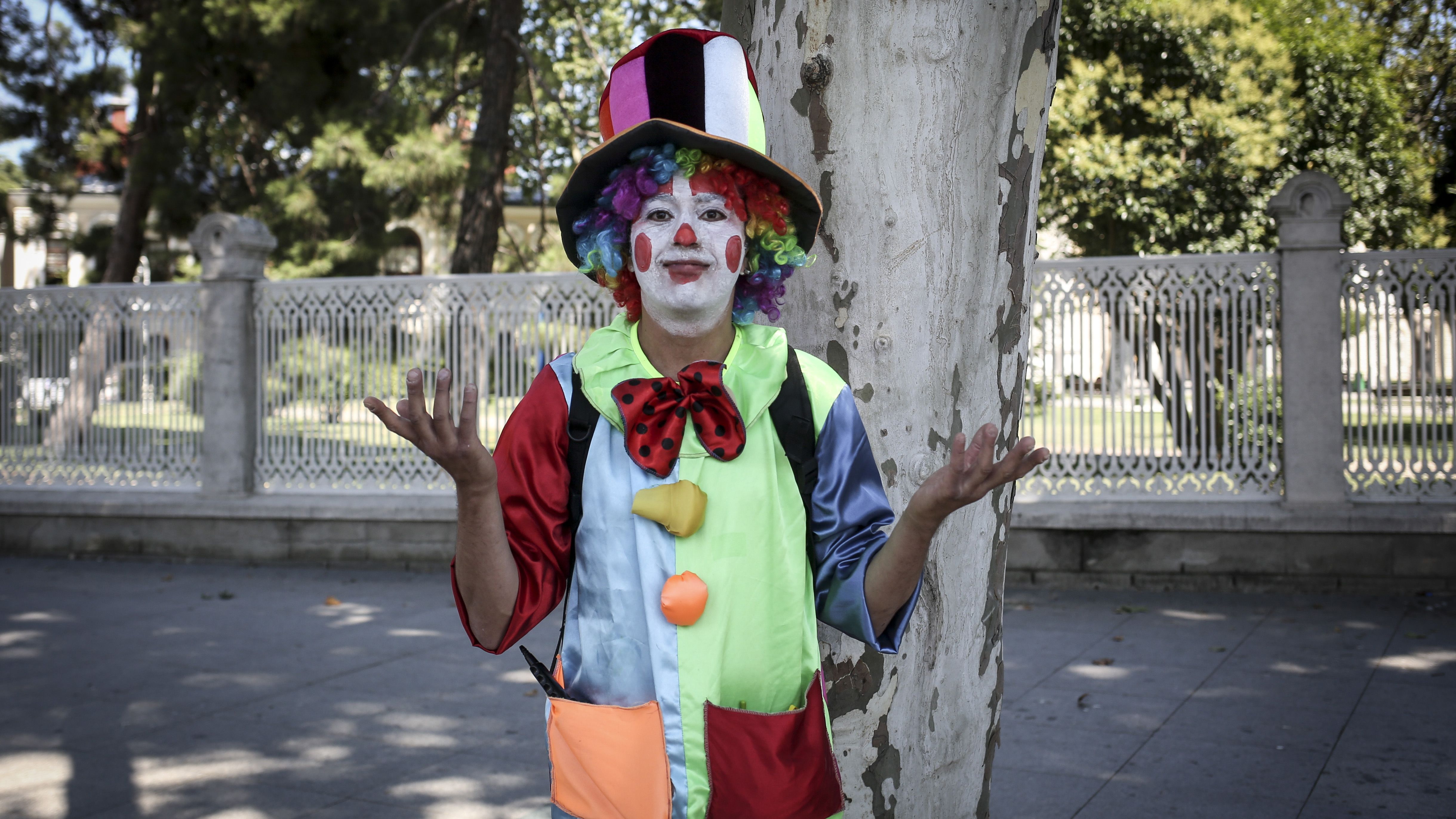 Tolga, a professional clown, poses for a photo, in Istanbul.