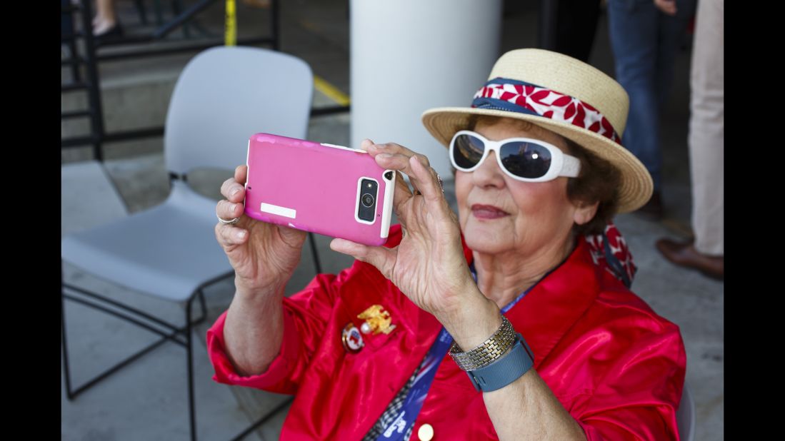 A woman takes a photo during the convention.