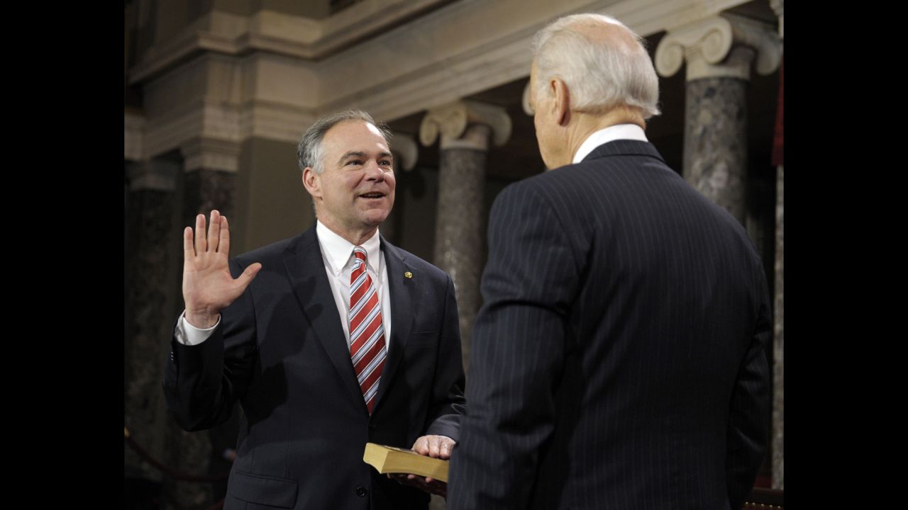 U.S. Vice President Joe Biden, right, administers the Oath of Office to Kaine during a mock swearing-in ceremony in 2013.
