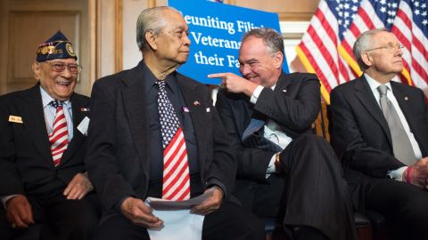 Kaine, along with World War II veterans and Senate Minority Leader Harry Reid, attend a news conference on Capitol Hill on June 9.