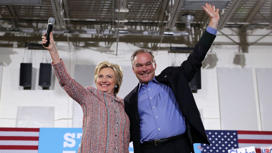 Kaine waves with Hillary Clinton during a campaign event in Annandale, Virginia, on July 14.