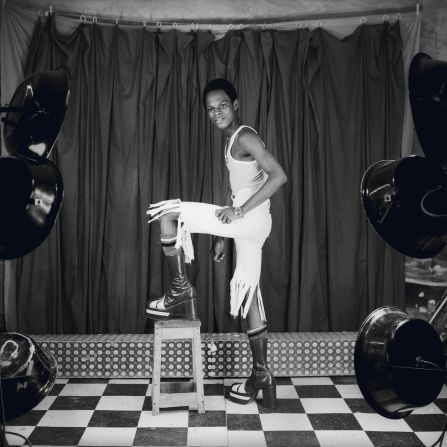 Born in Cameroon, Samuel Fosso grew up in Nigeria, but fled from the Biafran war to Bangui, Central African Republic and set up his own studio at the early age of 13. At night, after he'd closed for business, Fosso would pose in tight shirts, short pants, and platform heels -- items of clothing banned under CAR's dictatorship. 