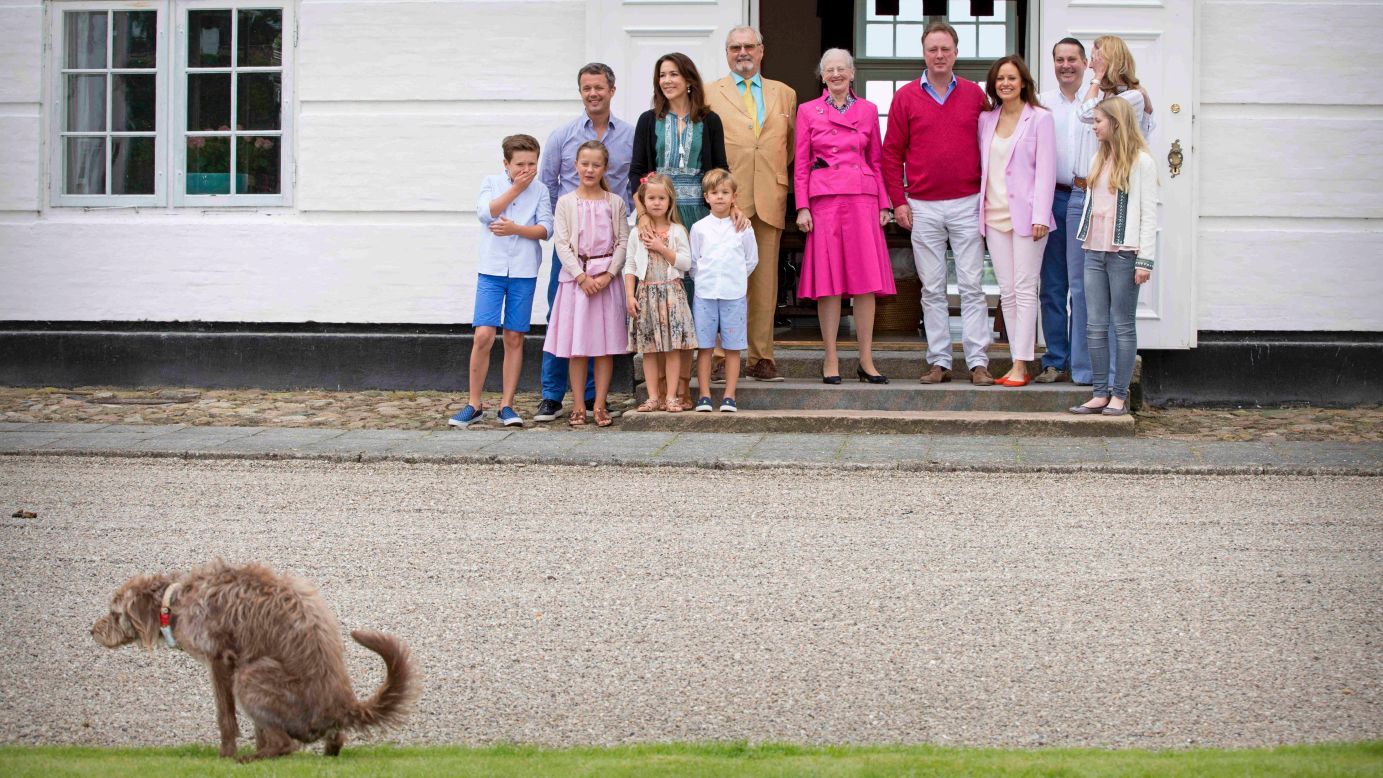 Nature calls as the Danish royal family poses for media photos on Friday, July 15.