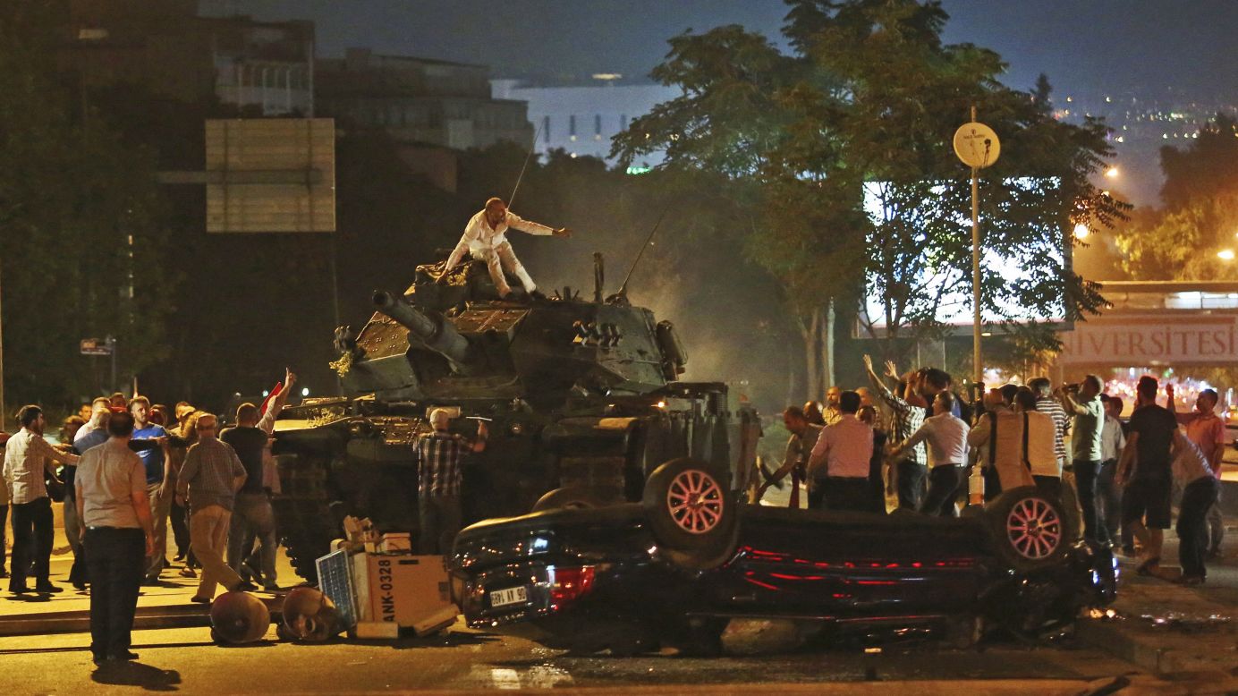 People in Ankara, Turkey, try to stop tanks during the country's failed coup attempt on Saturday, July 16. President Recep Tayyip Erdogan had called on Turks to take to the streets to show their support for the government.