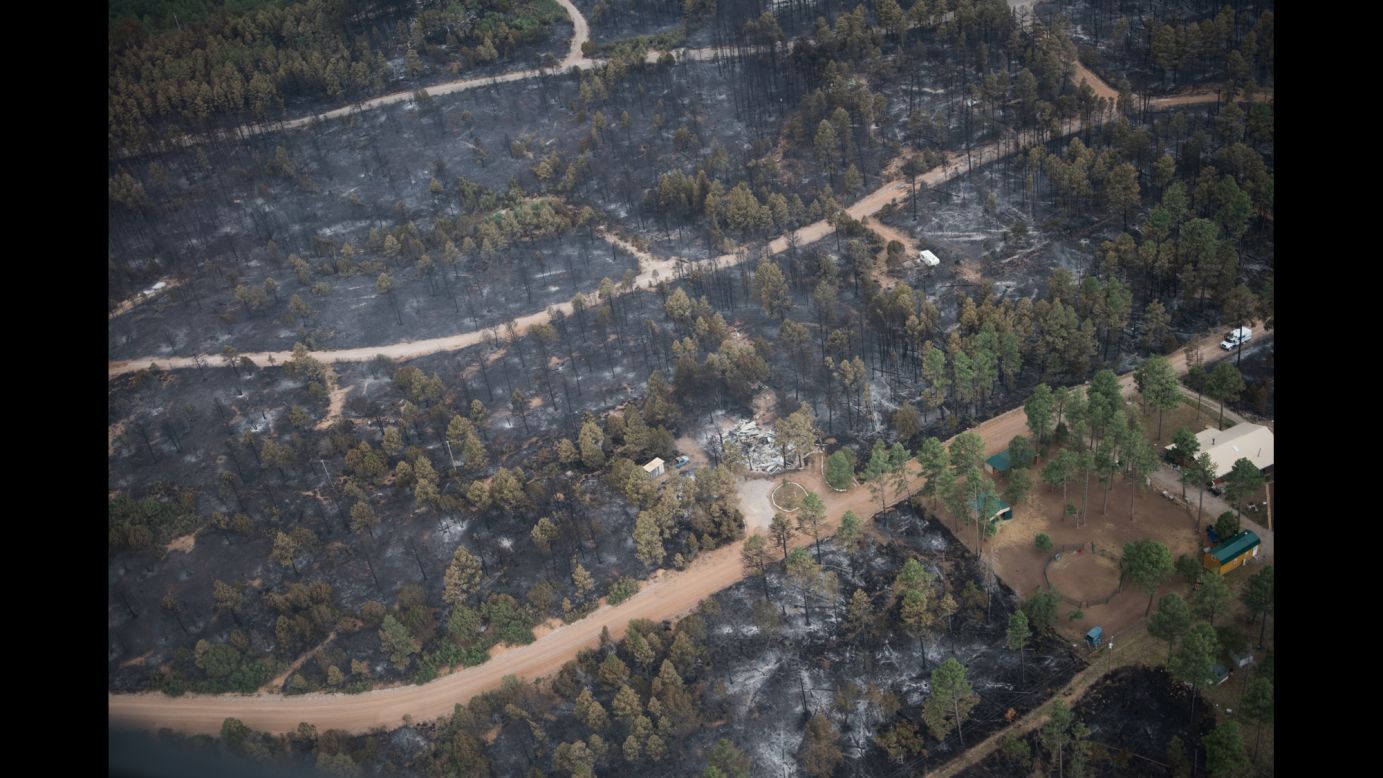 This aerial photo shows the remains of a home that was consumed by a wildfire in the village of Timberon, New Mexico, on Friday, July 15. New Mexico Gov. Susana Martinez declared a state of emergency in response to a wildfire in Otero County.