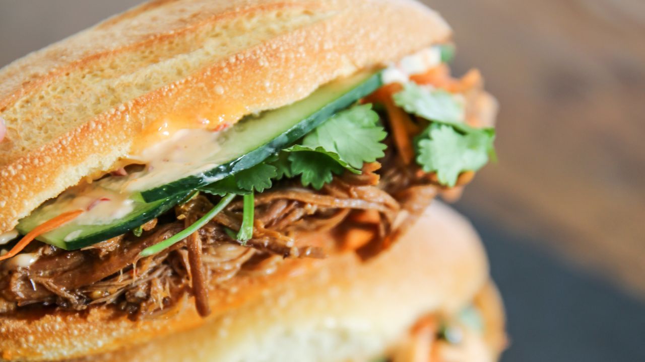 Num Pang Sandwich Shop, a Cambodian banh mi-style sandwich shop, serves an addictive pulled Duroc pork with spiced honey, accompanied by cucumber, pickled carrots, cilantro and chili mayo.