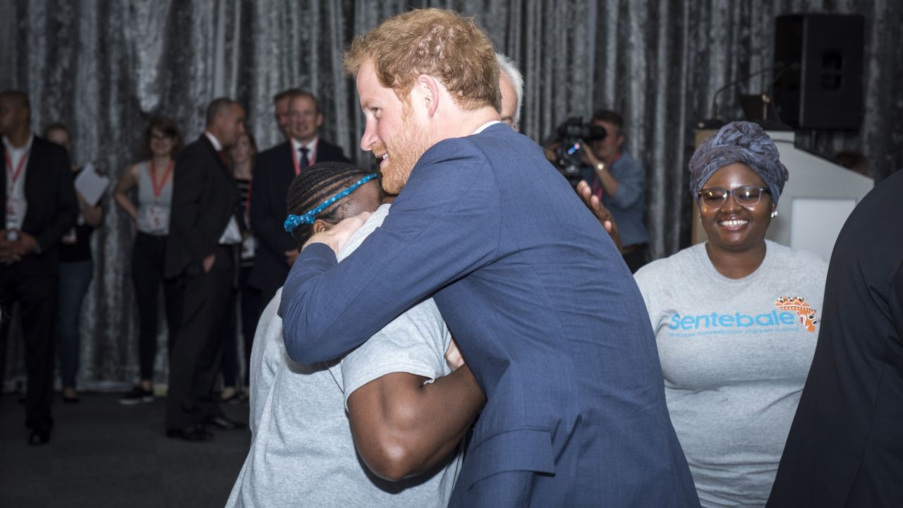 Prince Harry, as he arrived at the International AIDS Conference and greeted someone from his charity, Sentebale.
