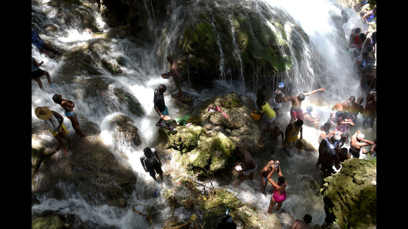 People bathe at a waterfall during the annual pilgrimage in Saut-d'Eau, Haiti, on Saturday, July 16.