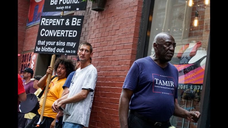 A scene on East 4th Street, outside the convention. The man at right is wearing a T-shirt in memory of Tamir Rice, the 12-year-old boy killed by police gunfire in November 2014.