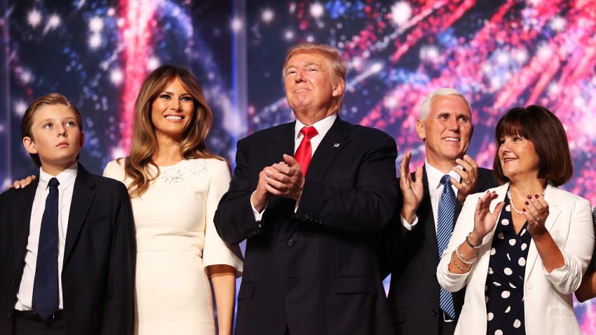 (L-R) Barron Trump, Melania Trump, Republican presidential candidate Donald Trump, Republican vice presidential candidate Mike Pence and Karen Pence acknowledge the crowd at the end of the the Republican National Convention on July 21, 2016 at the Quicken Loans Arena in Cleveland, Ohio. Republican presidential candidate Donald Trump received the number of votes needed to secure the party's nomination. An estimated 50,000 people are expected in Cleveland, including hundreds of protesters and members of the media. The four-day Republican National Convention kicked off on July 18. (Photo by John Moore/Getty Images)