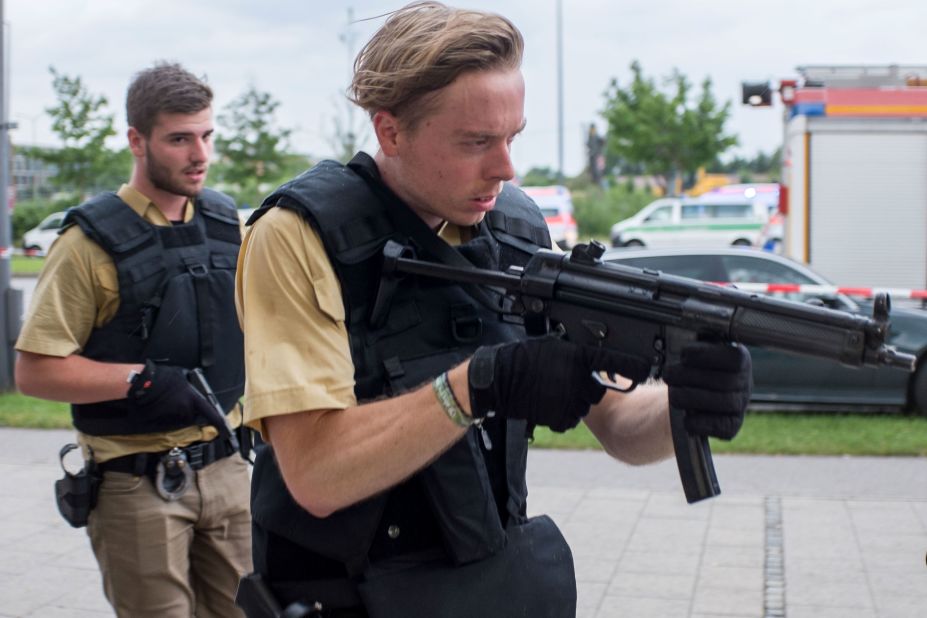 Armed police officers arrive at the mall.