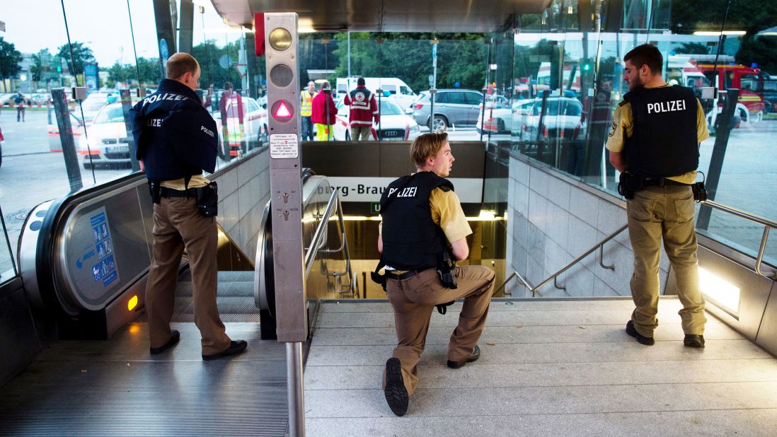 Police secure the entrance to a nearby transit station.