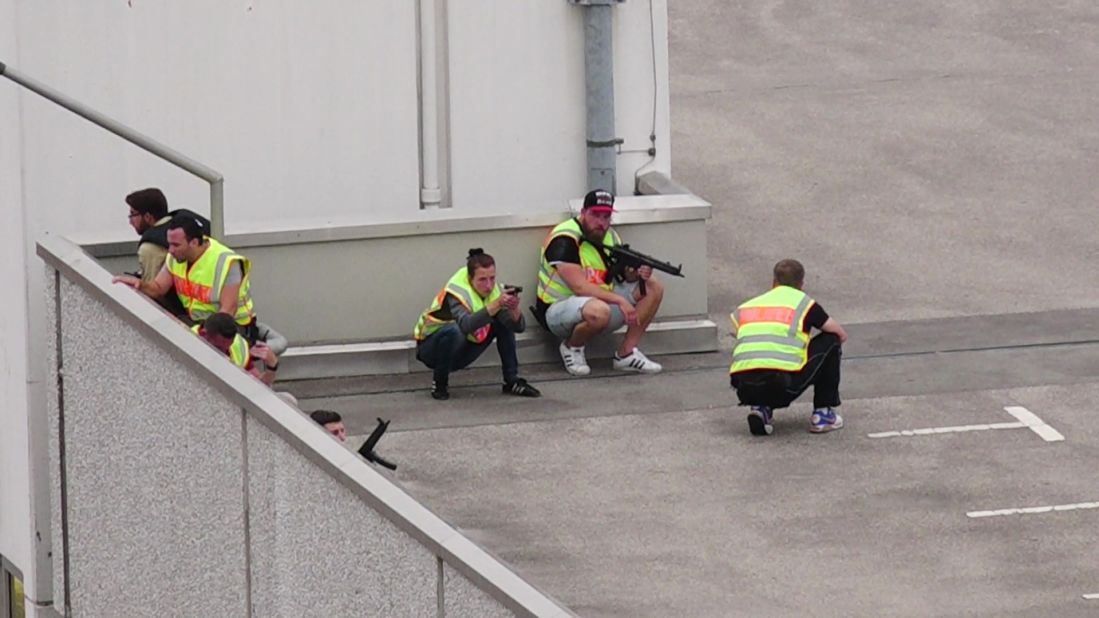 Police officers respond to the shooting.