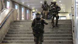RESTRICTED

July 22, 2016 - Munich, Bavaria, Germany - Policemen walking down stairs and securing the area in the underground station Karlsplatz (Stachus) after a shootout in Munich, Germany, 22 July 2016. After a shootout in the Olympia shopping centre in Munich, injuries and possible deaths were reported by the police. The situation is still unclear. PHOTO: ANDREAS GEBERT/dpa (Credit Image: © Andreas Gebert/DPA via ZUMA Press)