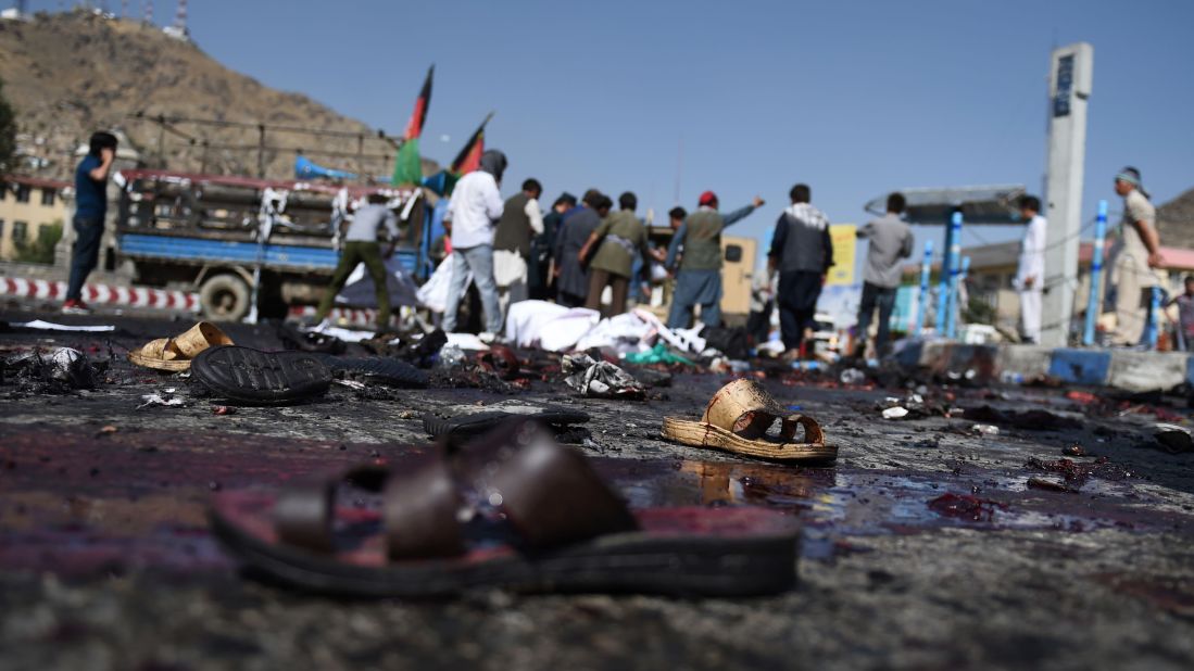The sandals of Afghan protesters remain at the scene.