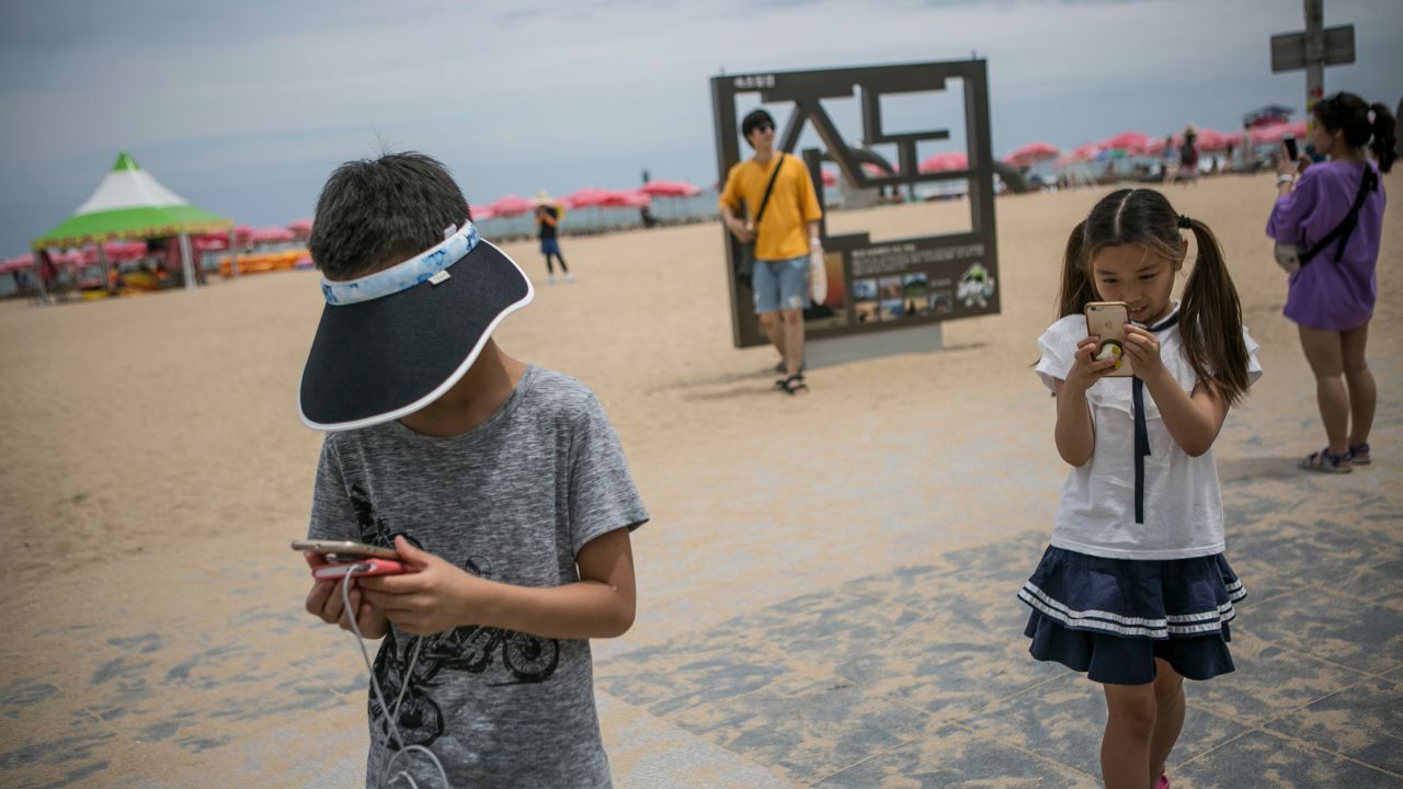 Children play Pokemon Go on July 15, 2016 in Sokcho, South Korea.
