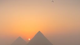 Solar Impulse 2, seen above the Pyramids of Giza on its approach to Cairo, Egypt.