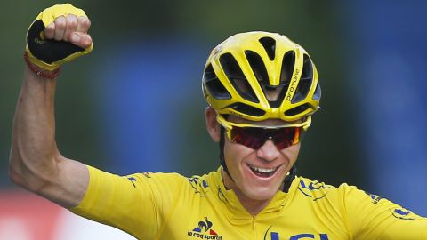 2016 Tour de France winner Chris Froome of Britain celebrates as he crosses the finish line in Paris.